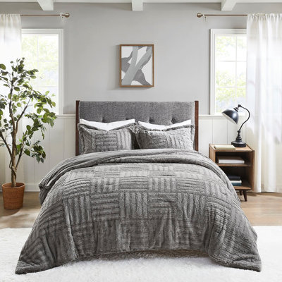 Édredon confortable en fausse fourrure très grand / très grand gris avec décoration en damier et ornement en duvet synthétique