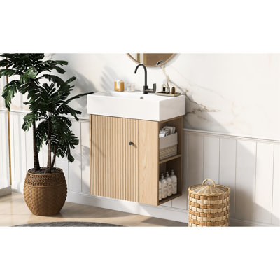 Meuble-lavabo mural moderne de 21,6 po avec poignée en or rose, fixation pour robinet à un trou, rangement latéral pour les petites salles de bain, porte ondulée, articles de toilette et design élégant