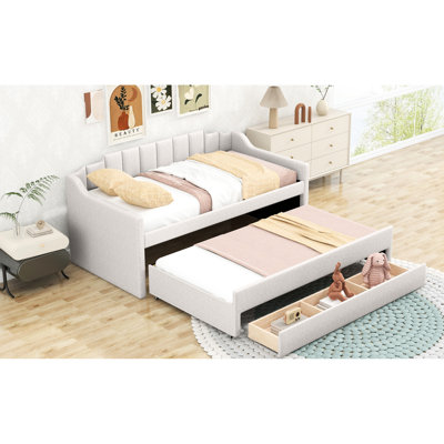Lit de jour simple rembourré beige avec lit gigogne - et la taille de l'option de chambre à coucher confortable dans les tiroirs offrent un endroit confortable pour la détente
