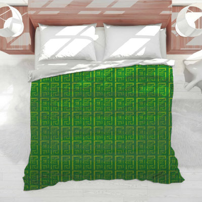 Édredon vert à motif géométrique