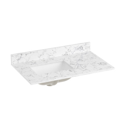 Plan de toilette en pierre reconstituée de 91 cm (36 po) avec lavabo encastré en céramique et dosseret.