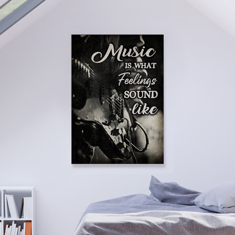 «Guitare sur fond noir - Music Is What Feelings Sound Like», reproduction d'art graphique sur toile tendue