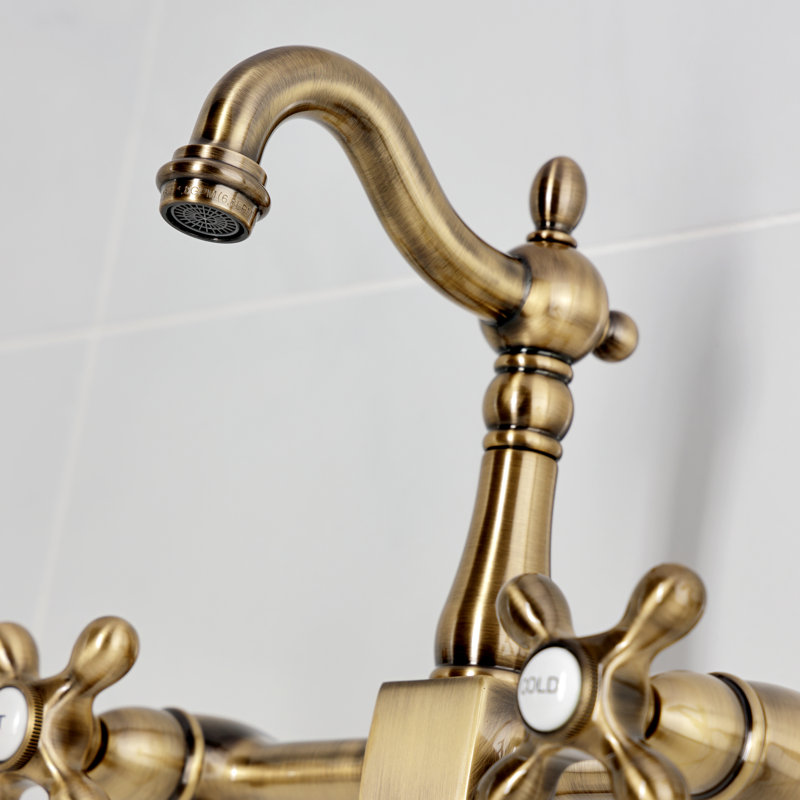 Kingston Brass Heritage Double-Handle 3-Hole Wall-Mount Bridge Kitchen Faucet with Brass Sprayer, Antique Brass