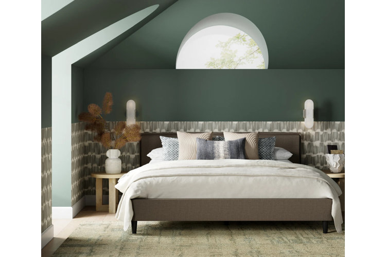 sage green bedroom with wallpaper on half the wall