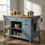 Îlot de cuisine mobile moderne avec plateau en bois d'hévéa, tiroirs de rangement, tablettes ouvertes et barre à serviettes, roulettes pour la cuisine et la salle à manger
