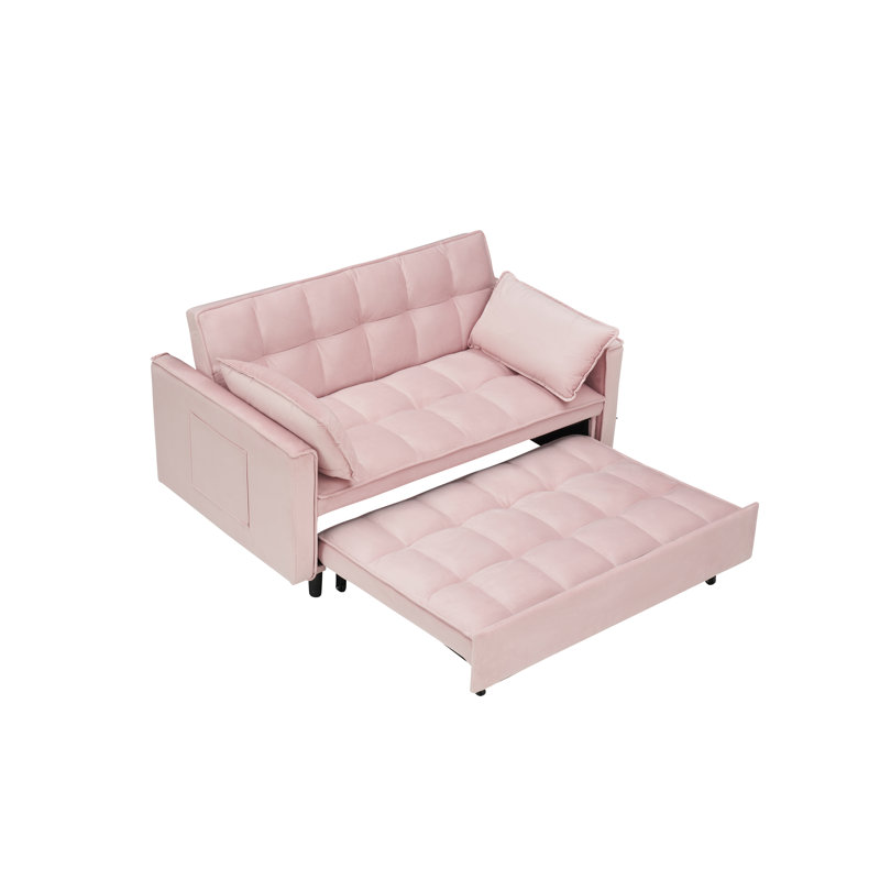 Canapé-lit convertible deux places en velours blanc de 140 cm de large avec lit gigogne, poche de rangement latérale et 2 oreillers.