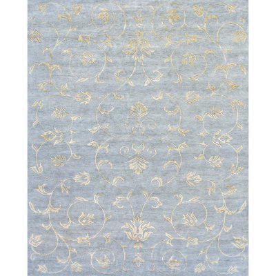 Tapis bleu clair et doré de haute qualité noué à la main
