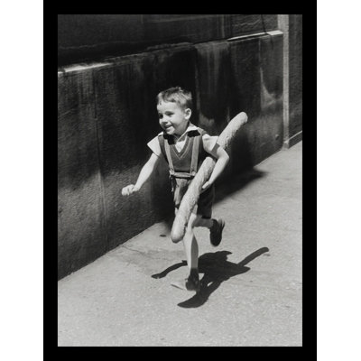 " France Boy Running With Big Loaf " by Willy Ronis