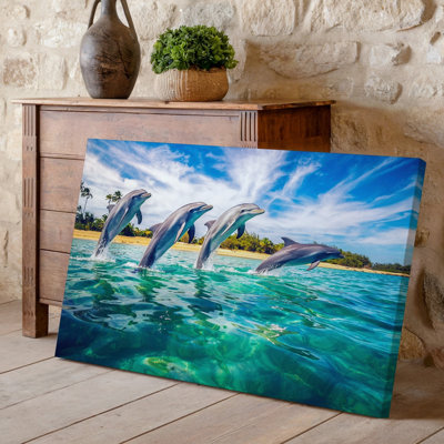 Toile, une scène tropicale vibrante mettant en vedette un groupe de quatre dauphins