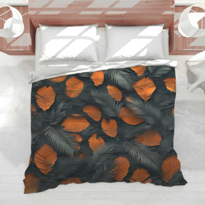 Édredon orange et feuilles noires