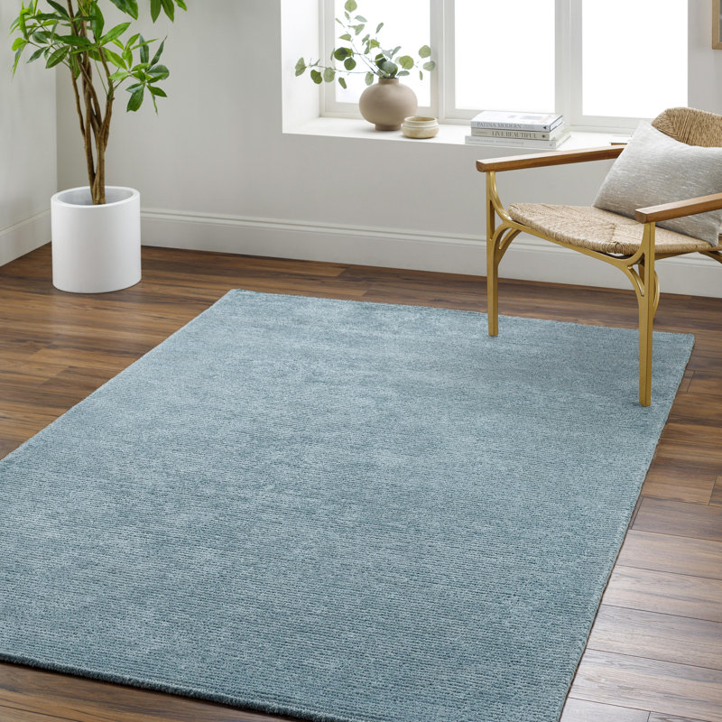 Tapis en viscose / laine touffeté à la main de couleur turquoise Dishaun, Rond 8 pi