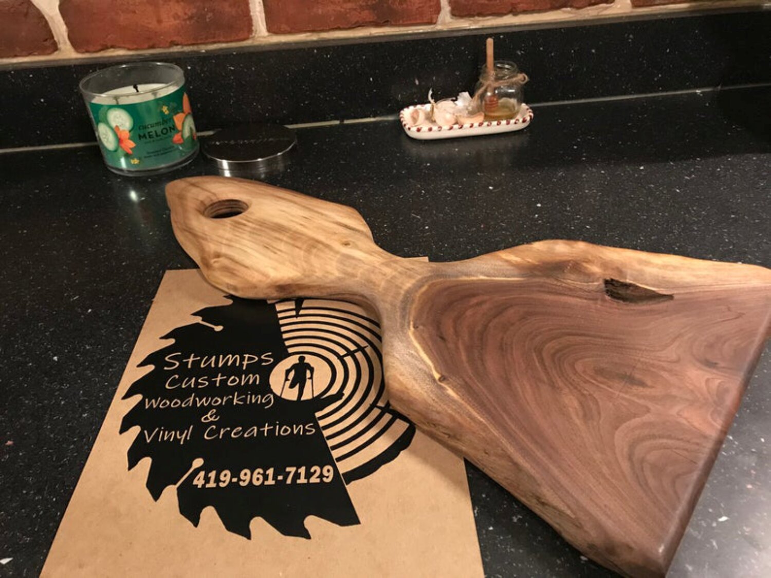 https://assets.wfcdn.com/im/73124589/compr-r85/1835/183542246/stumps-custom-wood-walnut-wood-cutting-board.jpg