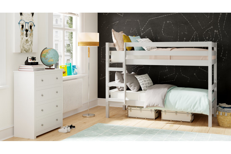 kids bedroom with a set of bunk beds in front of a chalkboard wall