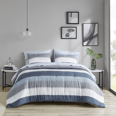Édredon simple à rayures avec feuilles bleues / grises. Tissu. Rembourrage. Édredon, 2 taies décoratives, 1 drap plat, taies d'oreiller ajustées. Convient à un matelas de 14 po ou moins. Lavable. Conception de drap. Microfibre. Bourre, machine