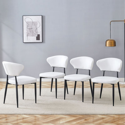 La chaise de salle à manger minimaliste et ergonomique, avec un dossier incurvé pour une conception confortable, libère une nouvelle position assise confortable et minimaliste. Un paquet de 4