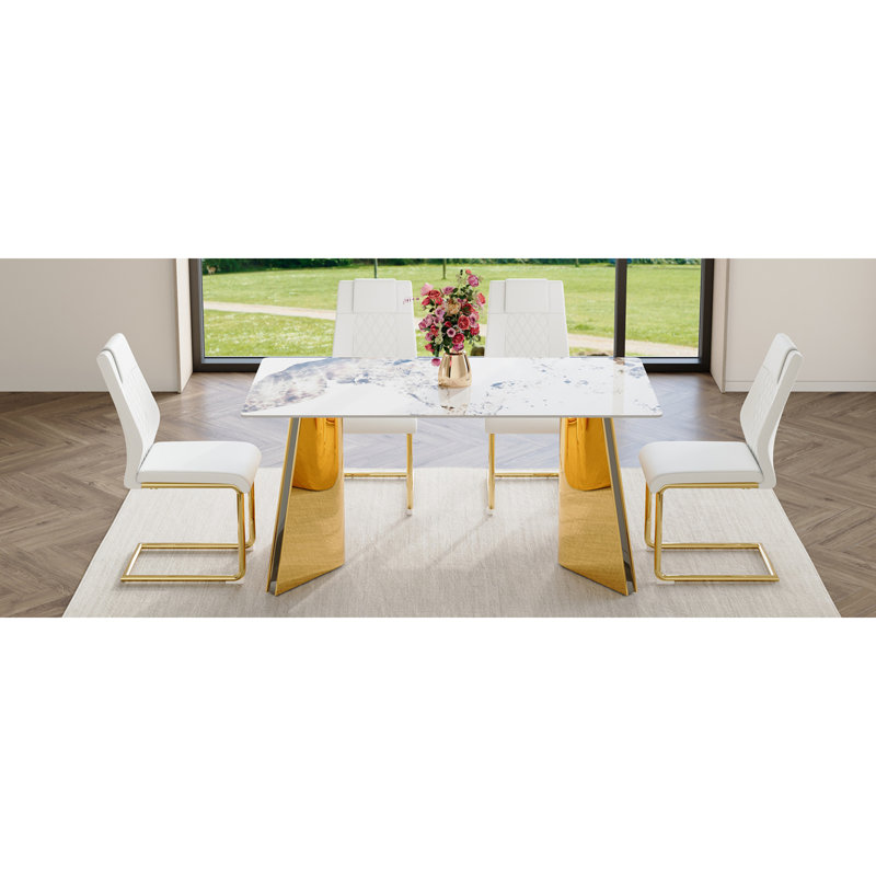 Ensemble de table de salle à manger luxueux Pandora avec pieds papillon dorés et chaises en polyuréthane blanc