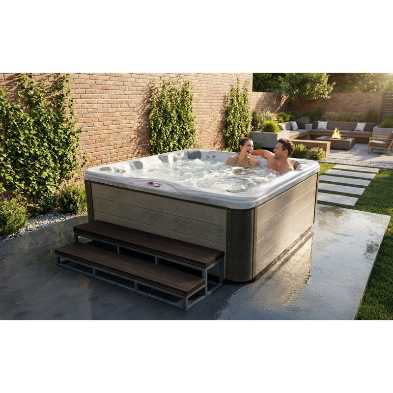 American Spas 7-Person 56-Jet Premium Bench Spa Standard Hot Tub With Sound System And LED Waterfall, Silver Oak