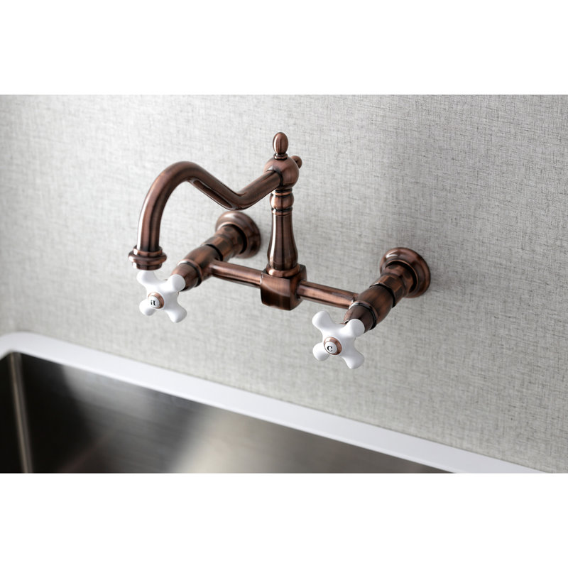 Kingston Brass Heritage Double-Handle 2-Hole Wall-Mount Bridge Kitchen Faucet, Antique Copper/White