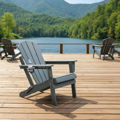 Folding Grey Adirondack Chair, Made Of Wood-Grain Composite Material, With Built-In Double Cup Holders, Making Your Patio Relaxation More Comfortable.