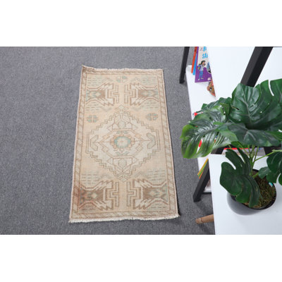 Tapis de porte turc rétro dans des tons beiges et pastel avec motif géométrique tissé à la main à partir de laine pour une décoration bohémienne