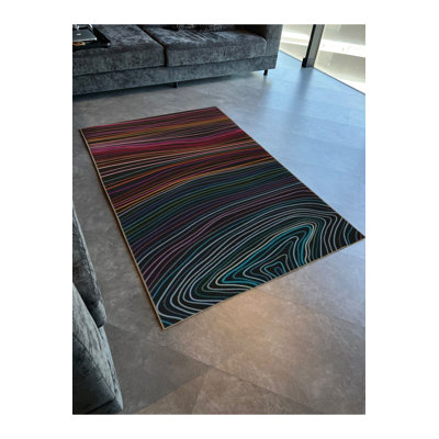 Tapis décoratif moderne et abstrait à spirale ondulée multicolore aux tons foncés lavable à la machine