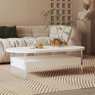 Oval rock slab suspended acrylic coffee table