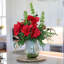 FRESH CUT RED AMARYLLIS IN GREEN GLASS-648599343