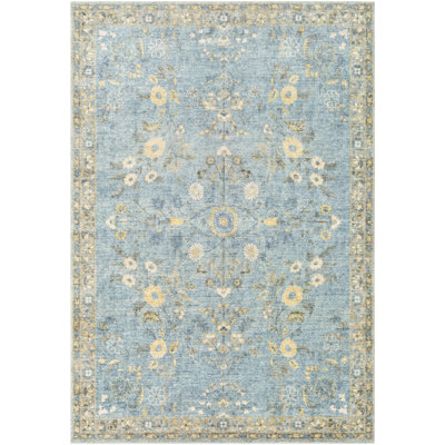 Tapis bleu à motif floral Berger