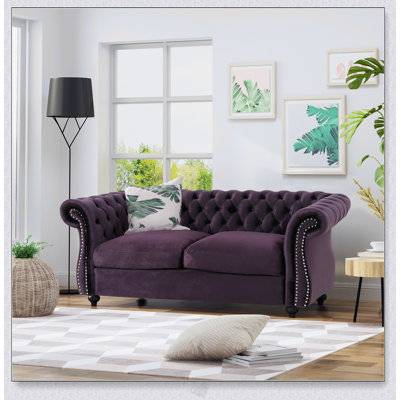 Canapé Chesterfield classique avec capitonnage à boutons profonds et détails cloutés pour une élégance et un confort intemporels