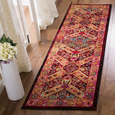 Donnitta Black/Light Orange Area Rug