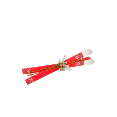 Red Wooden Skis Display with Aged Bells