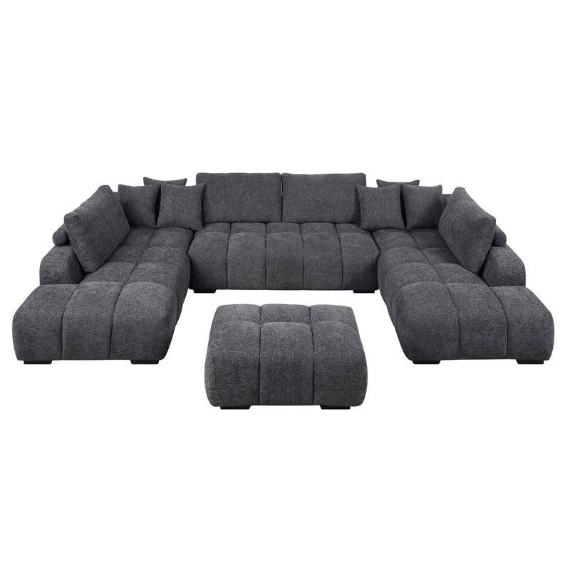 Canapé modulaire en chenille gris choisi avec coussins décoratifs et 2 repose-pieds