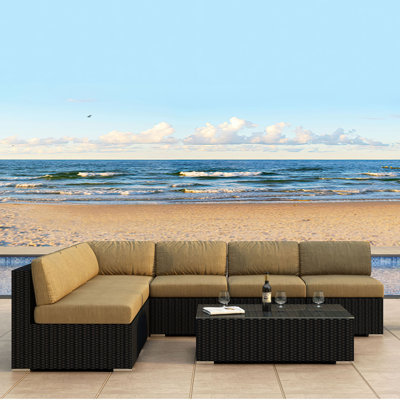 Suffern 7 Piece Rattan Sunbrella Sectional Seating Group with Cushions -  Wade LoganÂ®, 4A5F16A3ABFD4A57989238F1EDDDF901