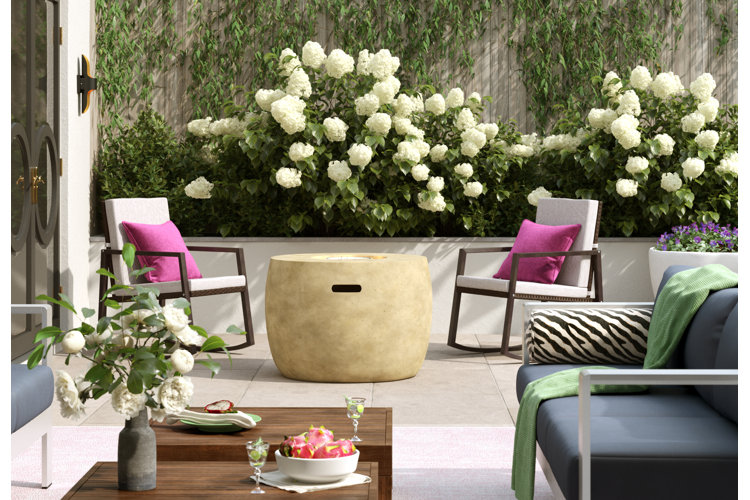stone patio with seating among flowers