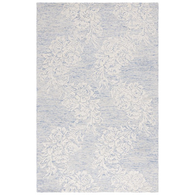 Tapis floral ivoire / bleu en laine / coton touffeté à la main Batholomew