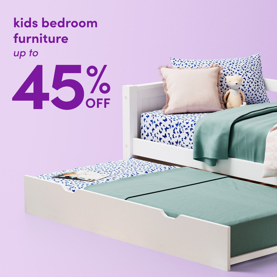 Kids bedroom furniture on sale for up to 45% off, featuring a white daybed with a pull-out trundle bed against a light purple background.