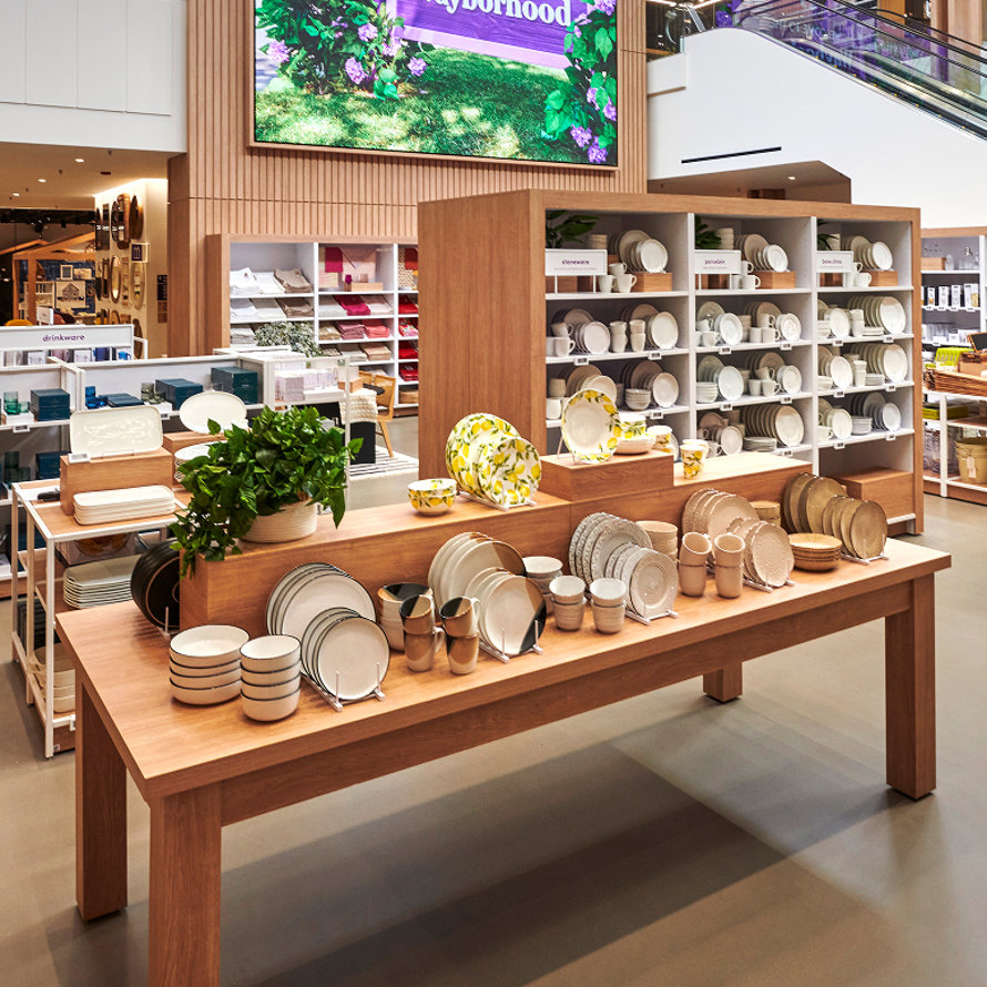 Dinnerware and stoneware on display in a retail store.