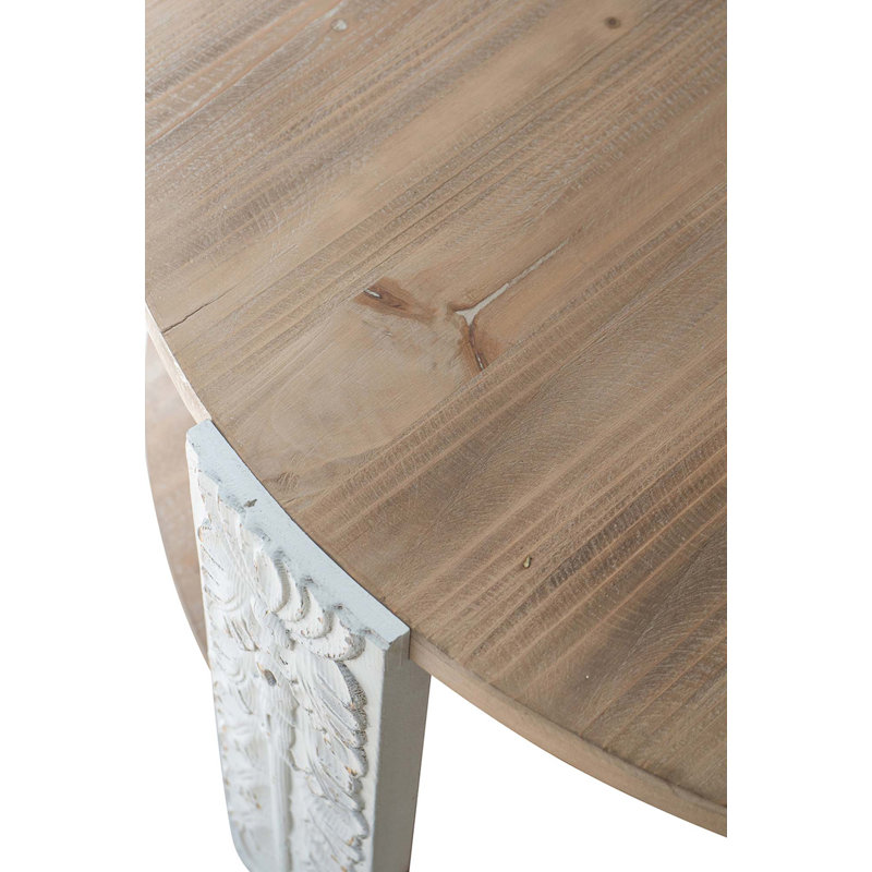 Table basse ronde en bois avec finition brun naturel, pieds sculptés blancs et tablette de rangement inférieure