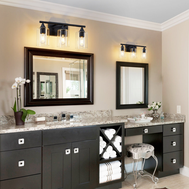Applique murale de salle de bain à 3 lumières, noir mat, style industriel, en métal avec abat-jour cylindrique en verre transparent, idéale pour un miroir de salle de bain.