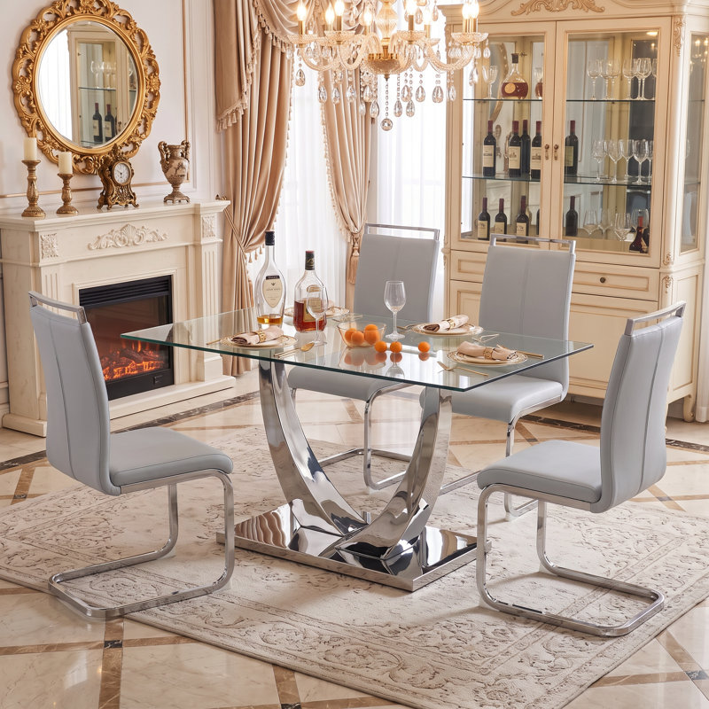 Ensemble de salle à manger 5 pièces rectangulaire moderne en verre trempé avec base en métal et chaises en porte-à-faux en similicuir