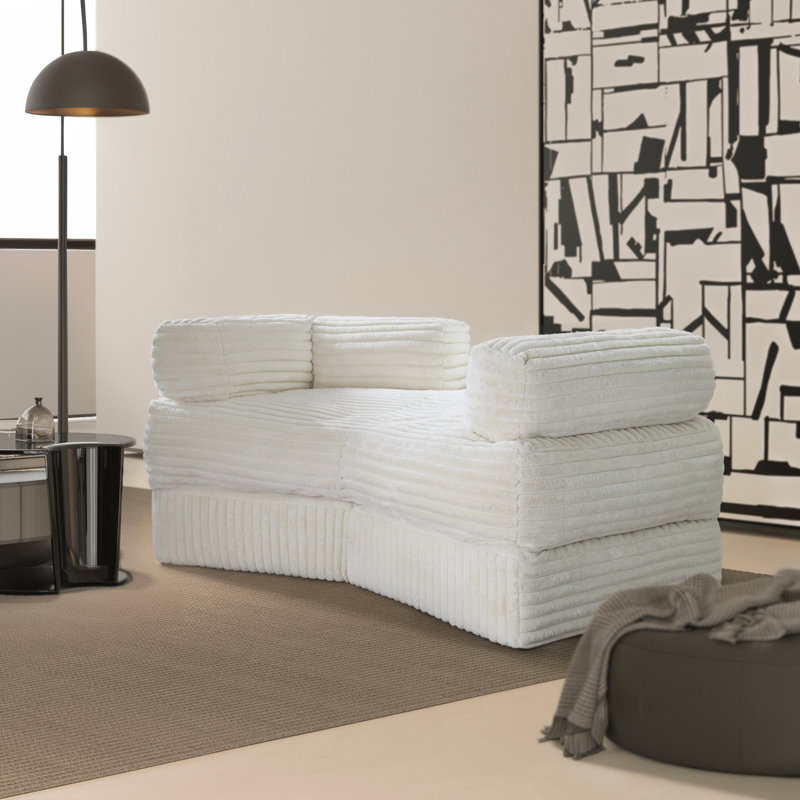 Chaise longue rayée en fausse fourrure de lapin