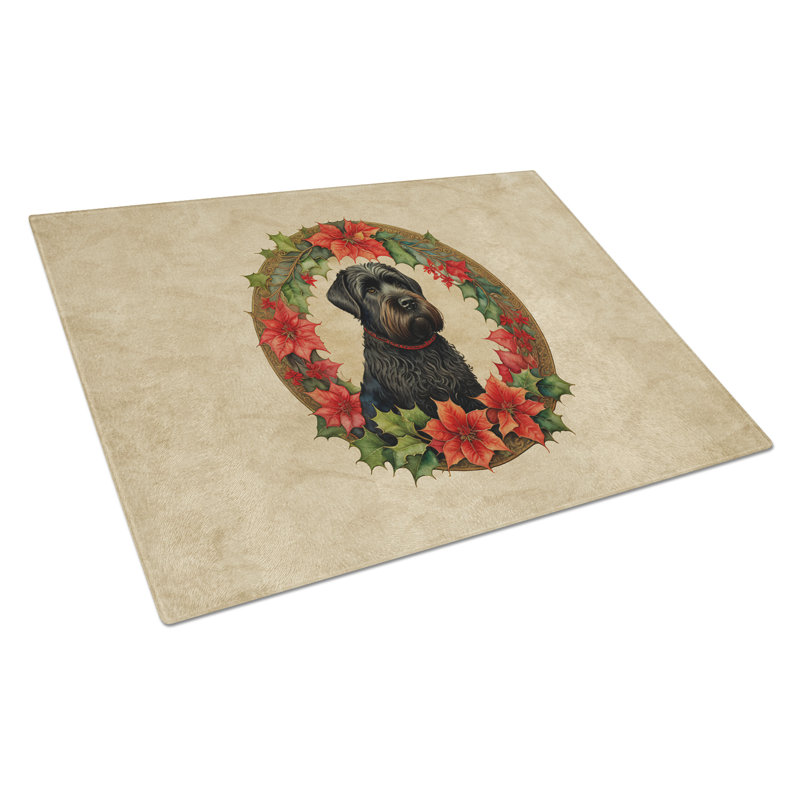 Planche à découper en verre noir avec fleurs de Noël et terrier russe