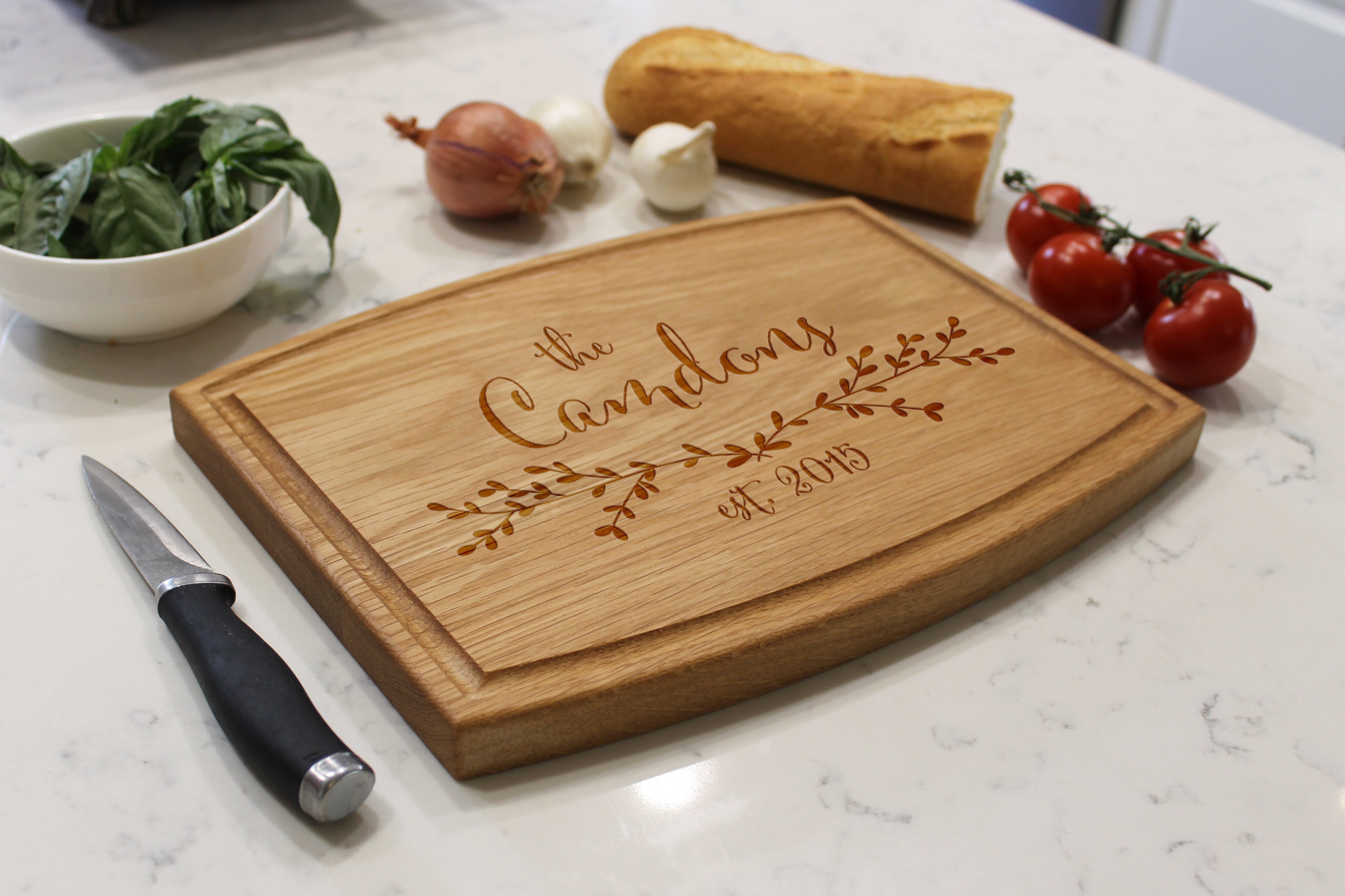 https://assets.wfcdn.com/im/73365262/compr-r85/5488/54883228/etchey-oak-wood-cutting-board.jpg