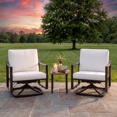 Ensemble de 3 chaises de jardin pivotantes avec structure noire et coussins blancs