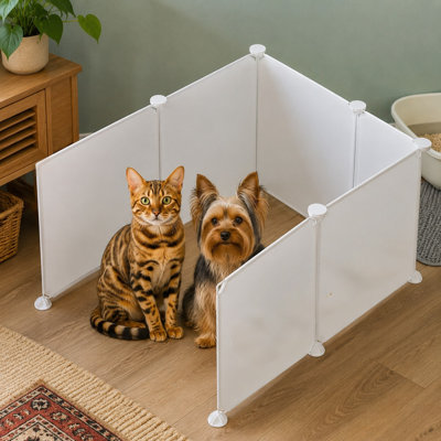 Lightweight extra-large plastic sheets form high pee-shield walls around the litter box, combining litter containment with a privacy screen and wall protector while remaining easy to clean.