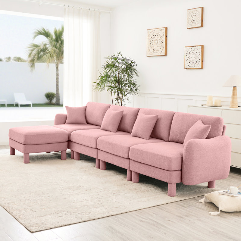 Canapé modulaire en L convertible en forme de L à 4 places avec pieds en forme de coquillage, amovibles et cylindriques. Confort et style pour votre espace de bureau