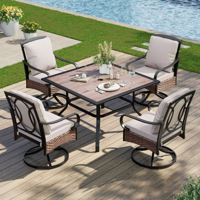 Aromola 4 - Person Wicker Patio Dining Set with Square Table , Cushions Included