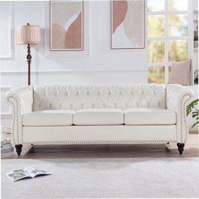 Stylish Rolled Arm Chesterfield 3 Seater Sofa with Soft PU Leather and Birch Legs, Compliant with US TB117 Standard.