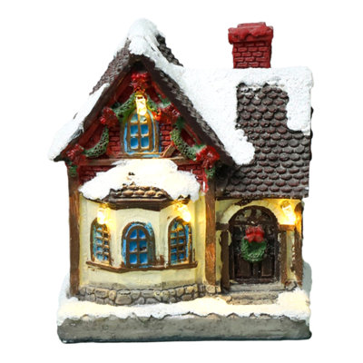 Maison de village de Noël illuminée, chalet enneigé en résine avec lumières DEL chaudes, mini figurine de maison de Noël pour décoration de table, foyer, étagère et sapin de Noël