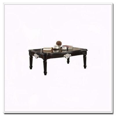 Table basse noire avec pieds tournés